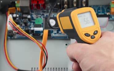 Infrared thermometer measuring a circuit board